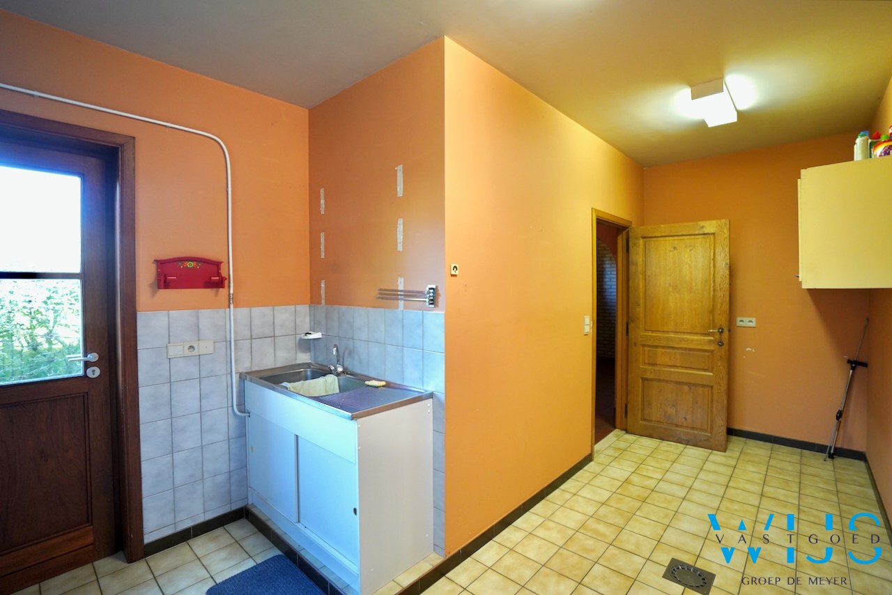 Fantastische open bebouwing met dubbele garage in gegeerde woonwijk te Evergem 