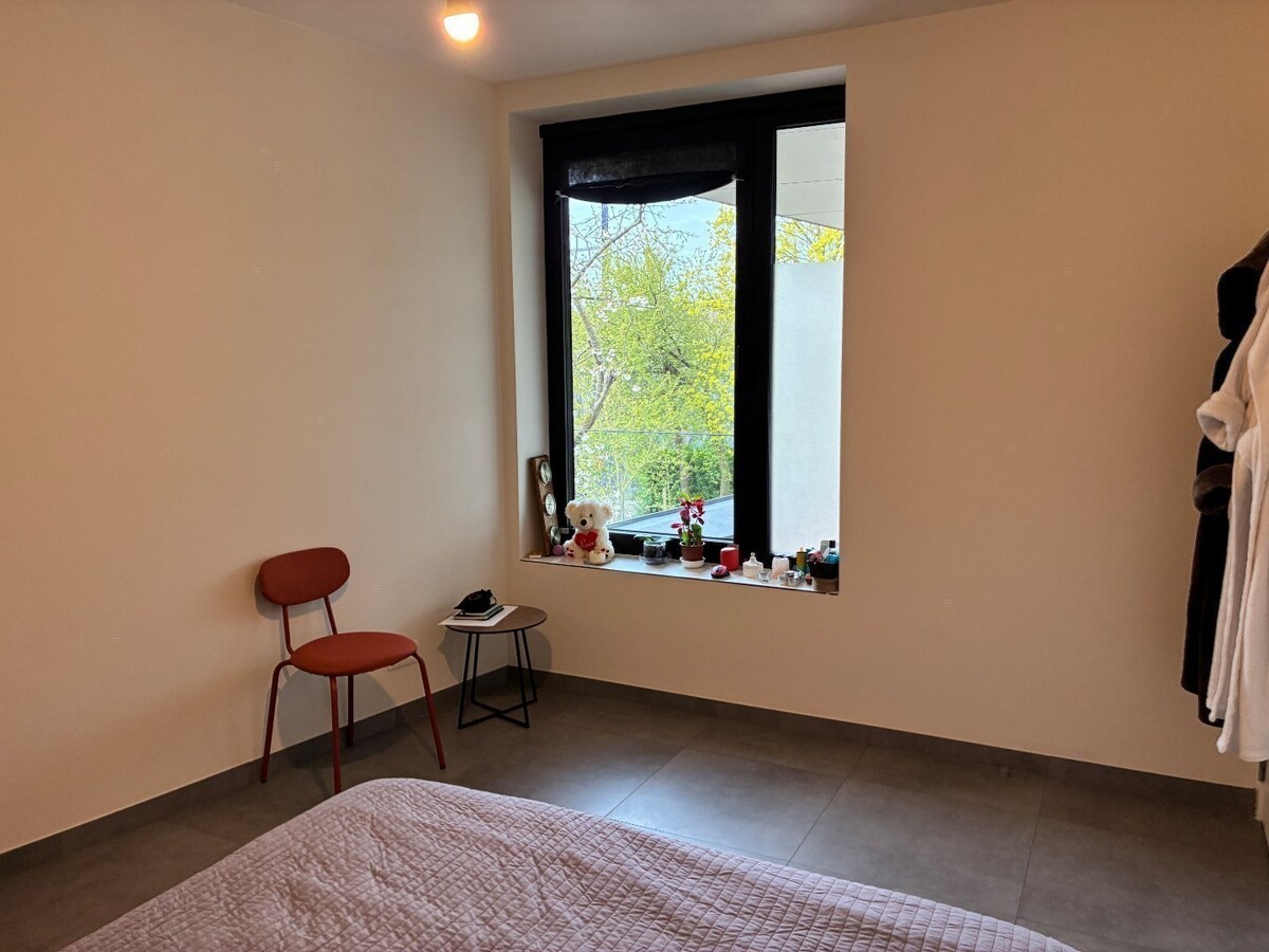 Nieuwbouwwoning op 50m van tramhalte - met terras en tuin ! 