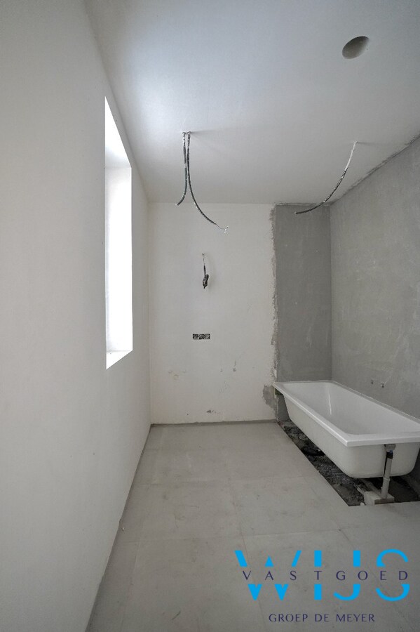 Gelijkvloers nieuwbouwappartement met private inkom en tuin 