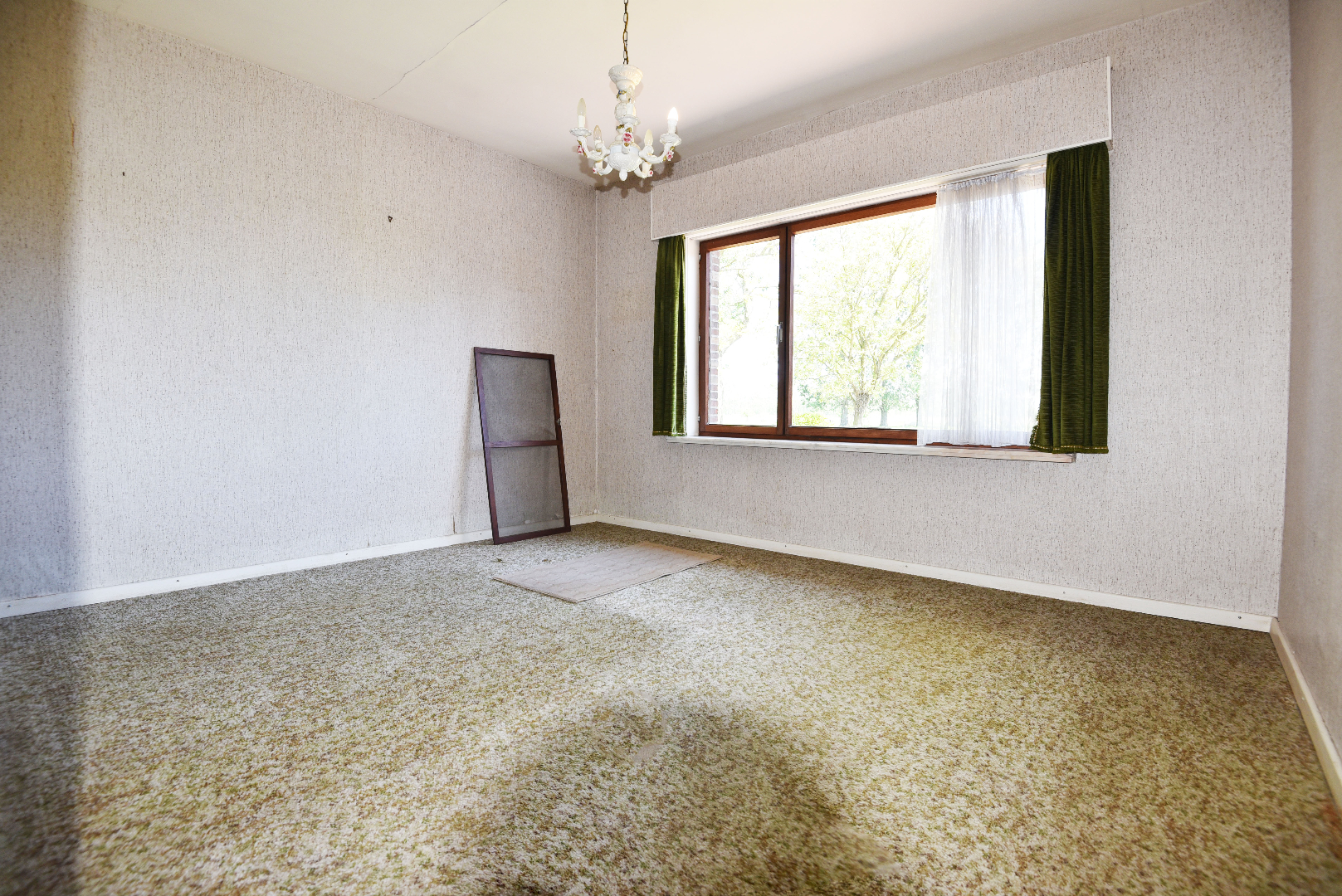 Op te frissen woning op 1.029m² met zicht op de velden te Kaprijke 