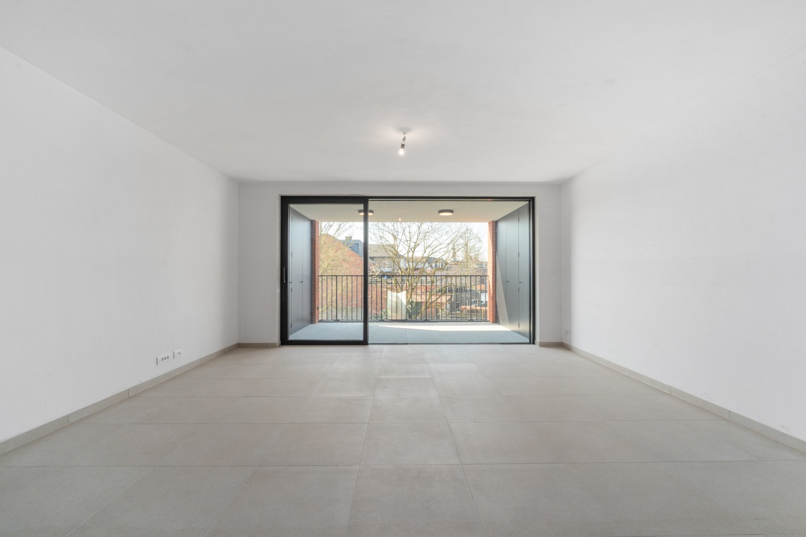 Nieuwbouwappartement met één slaapkamer, terras en ondergrondse autostaanplaats te koop in Zulte 