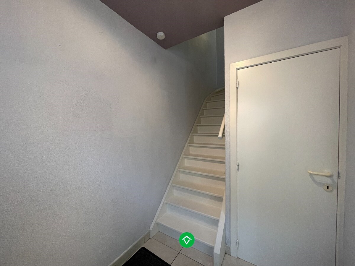 Gezellige rijwoning met 3 slaapkamers, terrastuin en garage te Kachtem 