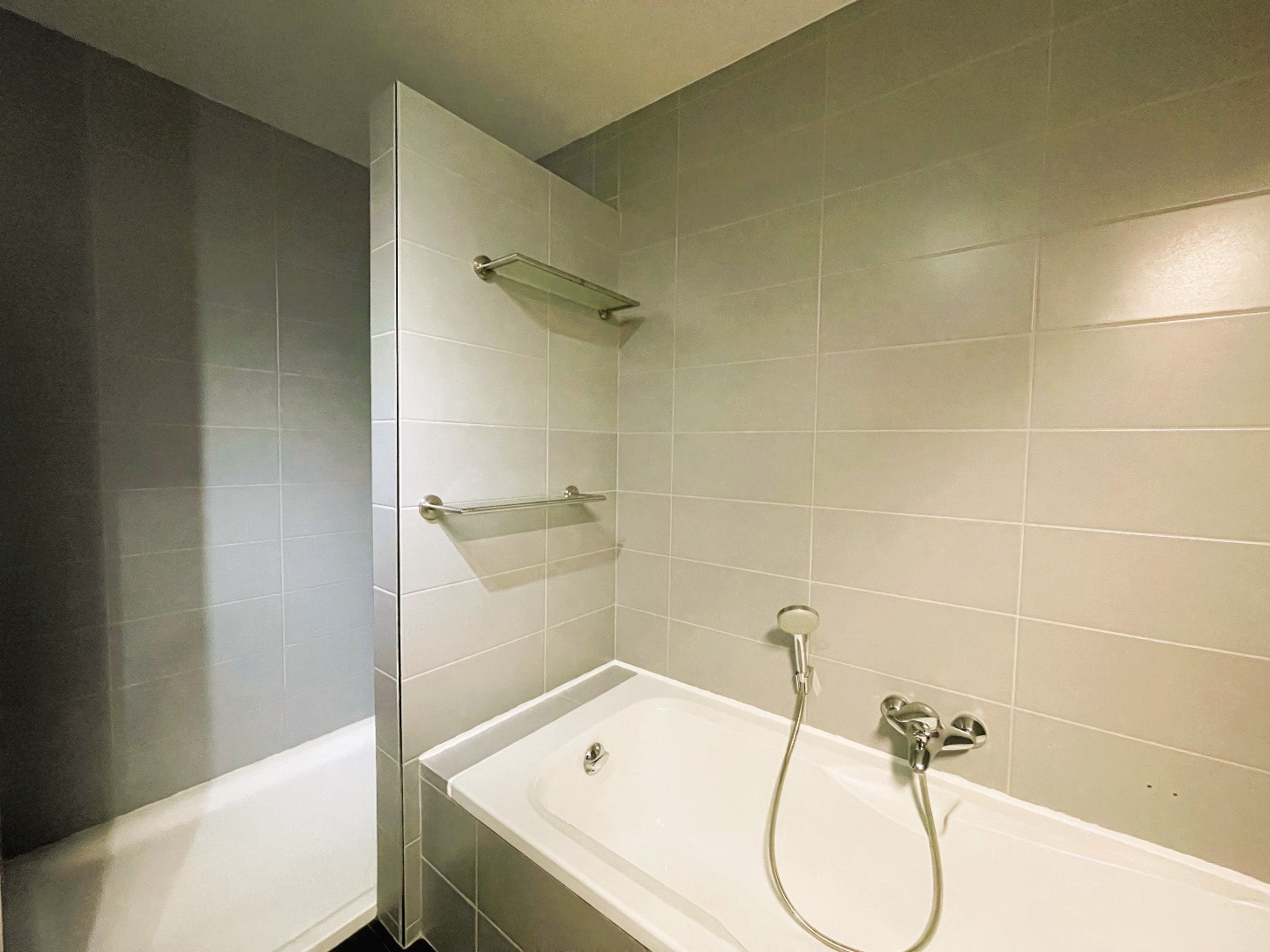 Gelijkvloers appartement met 2 slaapkamers en aangename tuin 