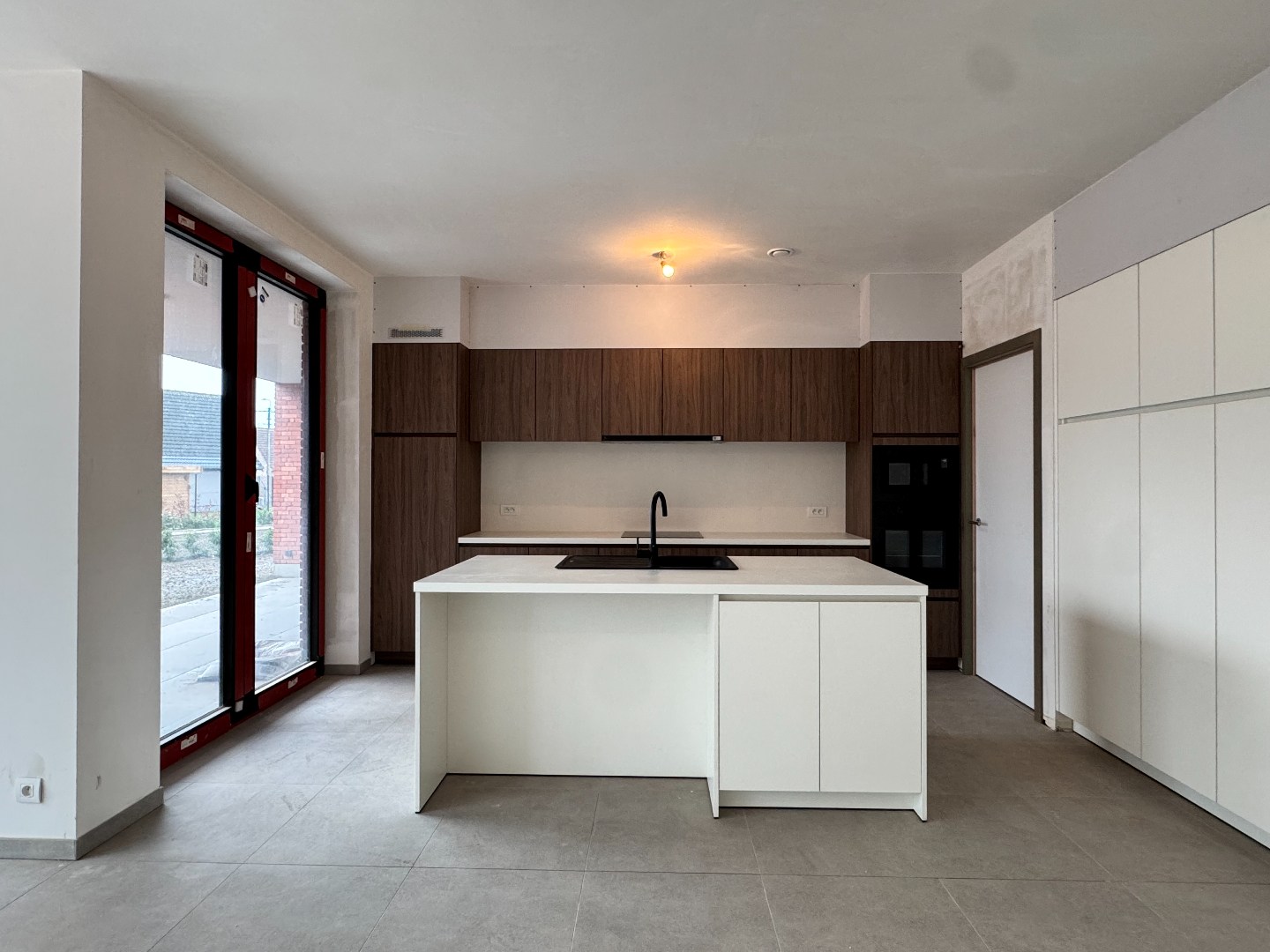 Nieuwbouwappartement met twee slaapkamers, tuin en ondergrondse autostaanplaats te koop in Zulte 