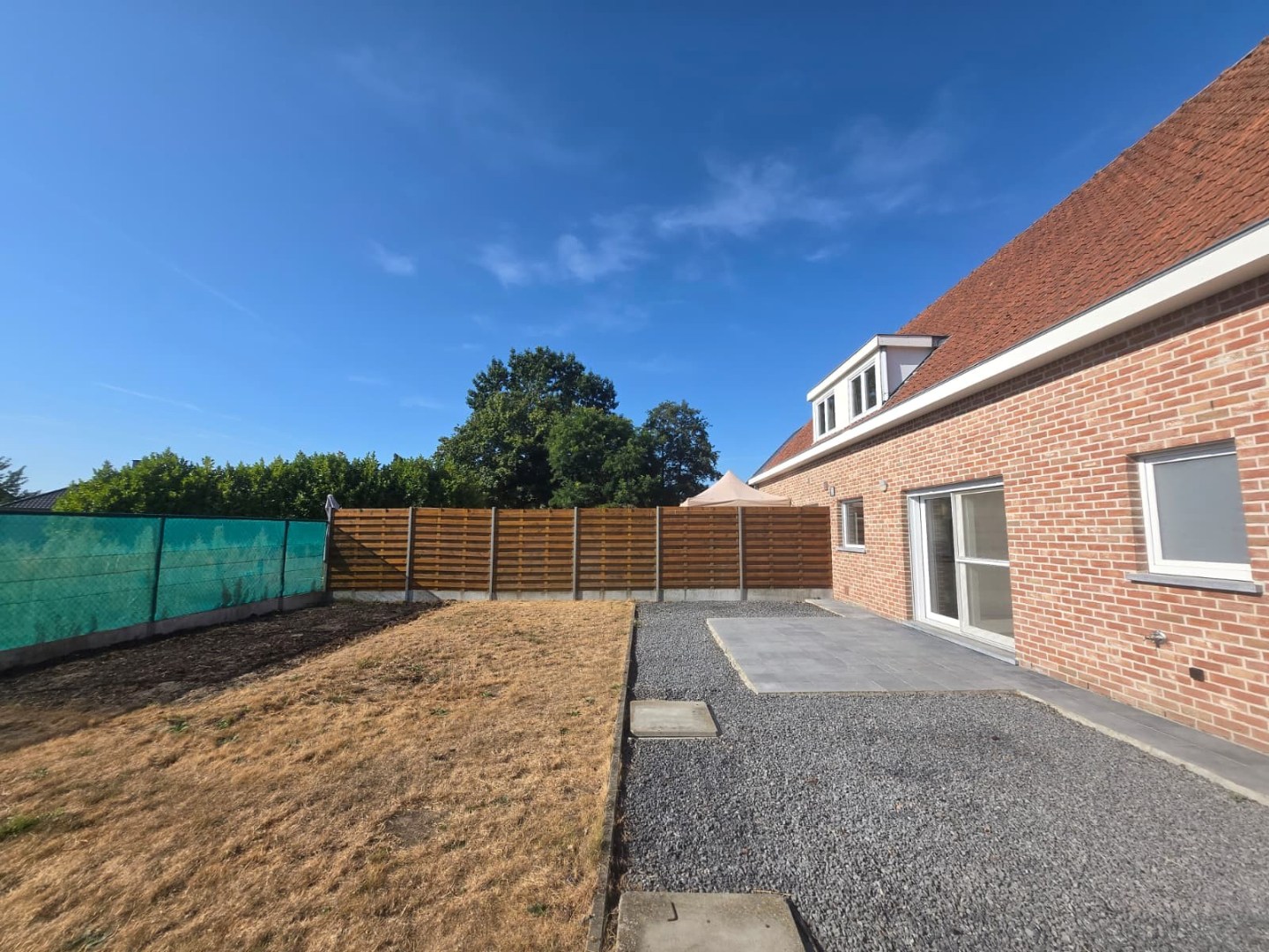 Energiezuinige halfopen woning met tuin en carport te Zulte 