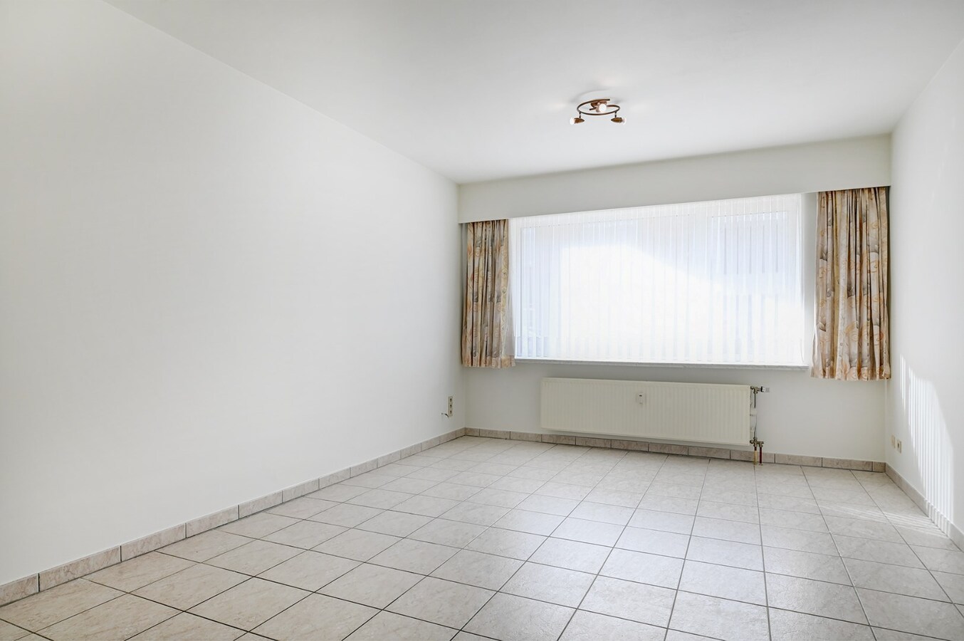 Centraal gelegen appartement met ondergrondse garage en groot terras 