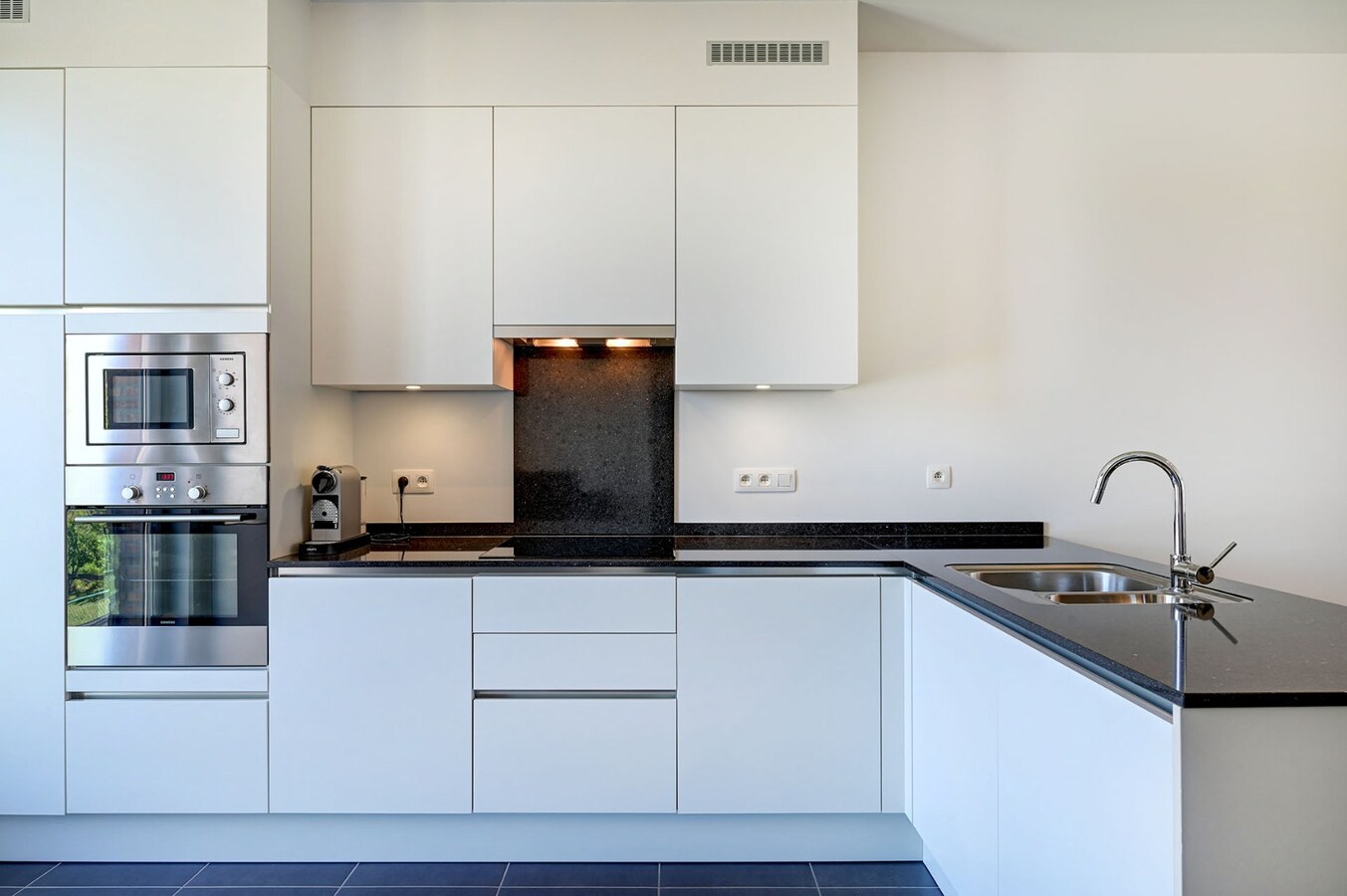 Centraal gelegen appartement met mooi terras en ondergrondse staanplaats 