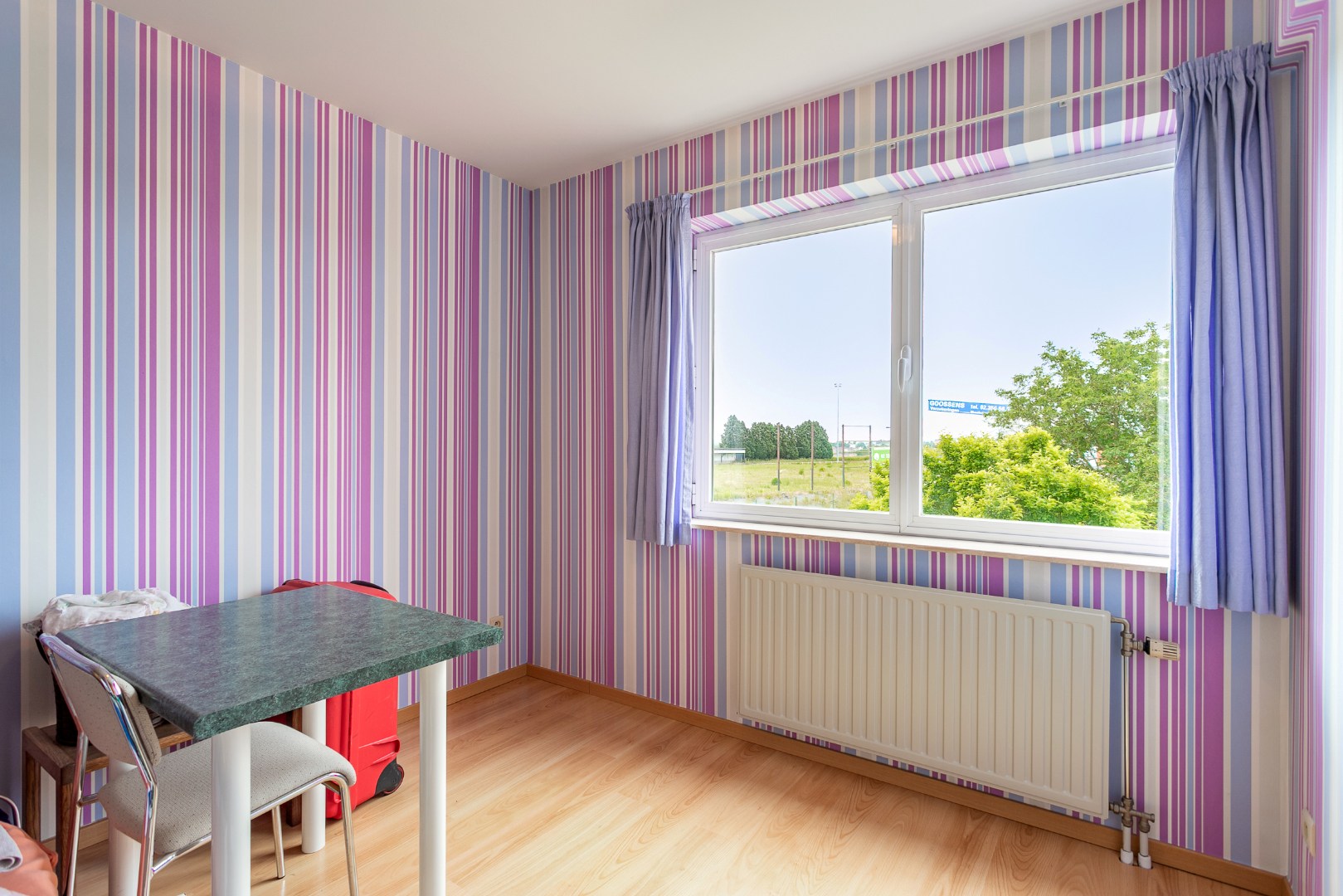 Verzorgde 3-gevelwoning met 3 slpk en tuin te Halle 