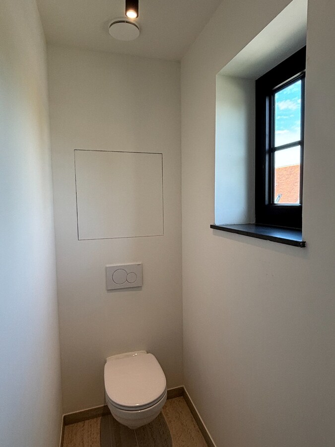Nieuwbouwwoning met West-tuin in het centrum van Schilde 