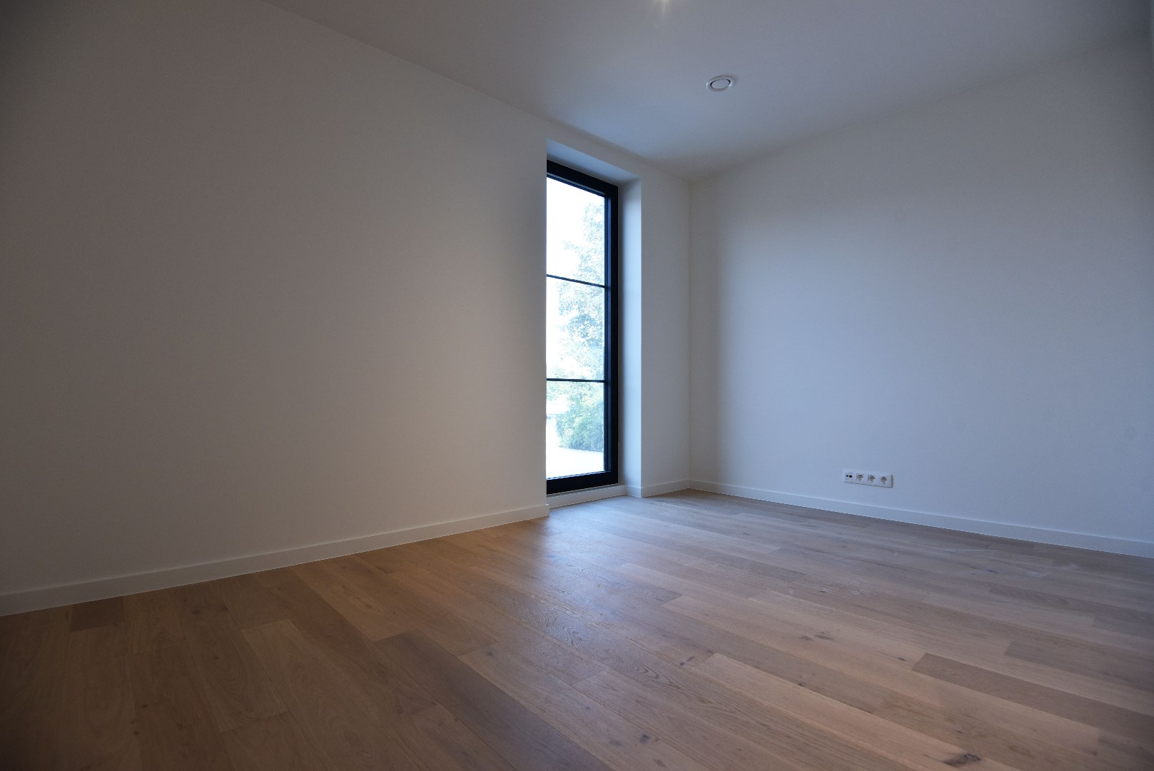 Nieuwbouwappartement met 2 slpks, autostaanplaats en terras te Maldegem centrum 