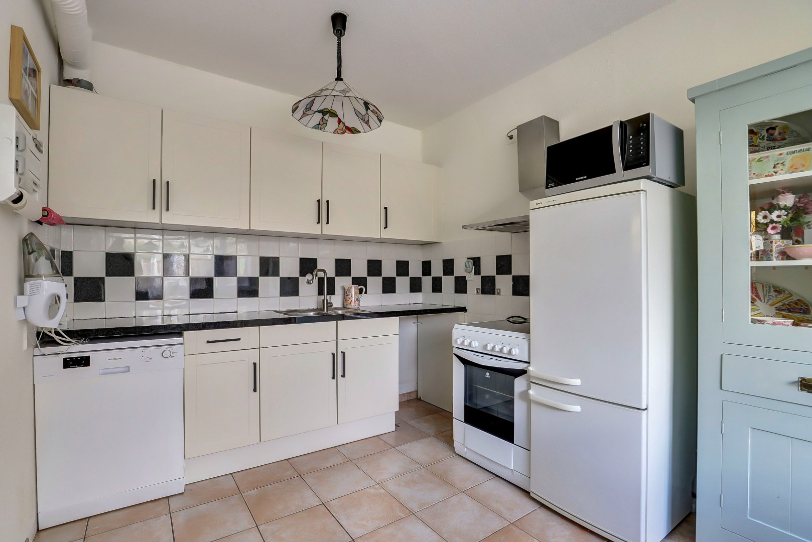 2-kamer hoekwoning met  ruime slaapkamer met airconditioning, tuin op het zonnige zuidwesten. 