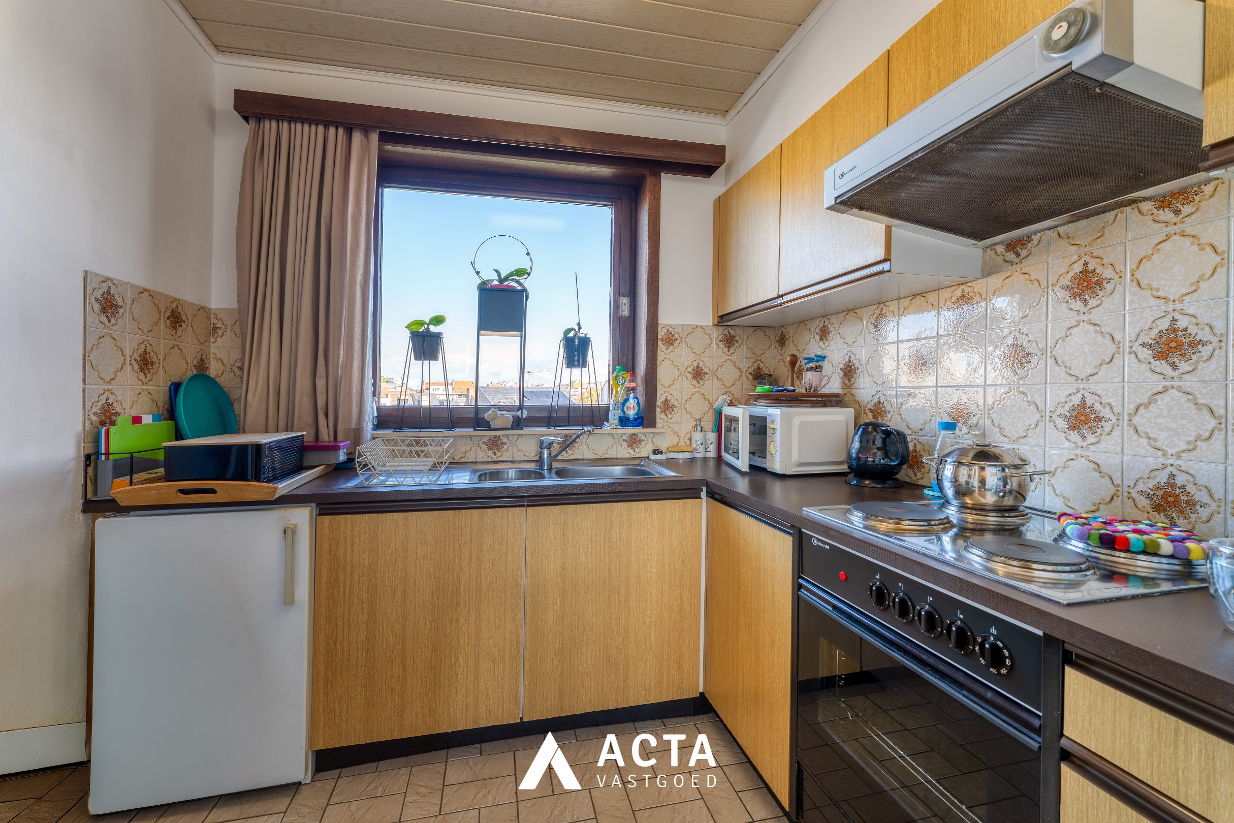 Dakappartement met zonnige terrassen in Mariakerke 