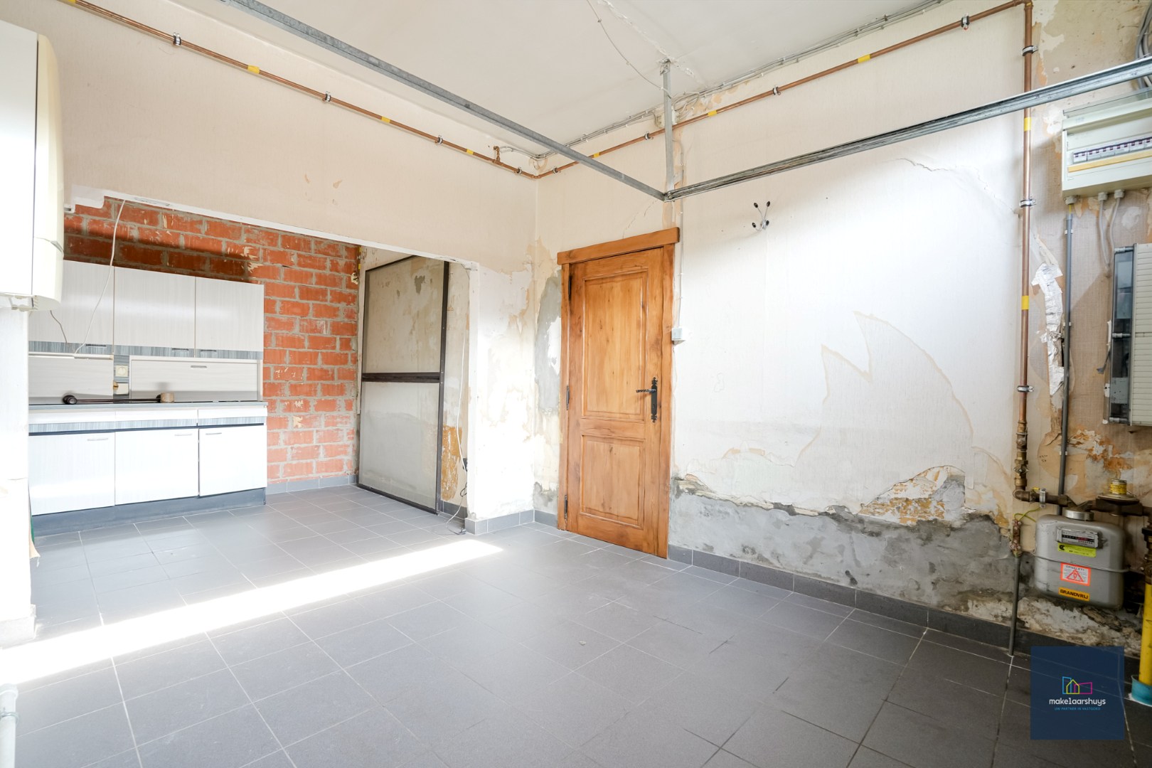 Ruime  halfopen bebouwing  met  zonnige tuin, terras en garage in Waarschoot 