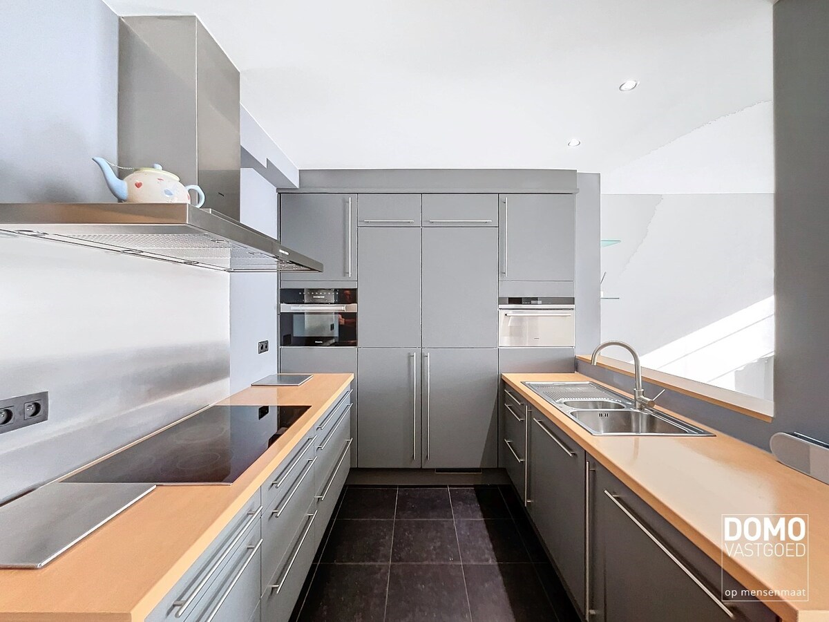 Duplex appartement met een gezellig tuintje, ondergrondse autostandplaats en 2 slaapkamers te Spalbeek - energielabel B, 109m² bewoonbare oppervlakte 