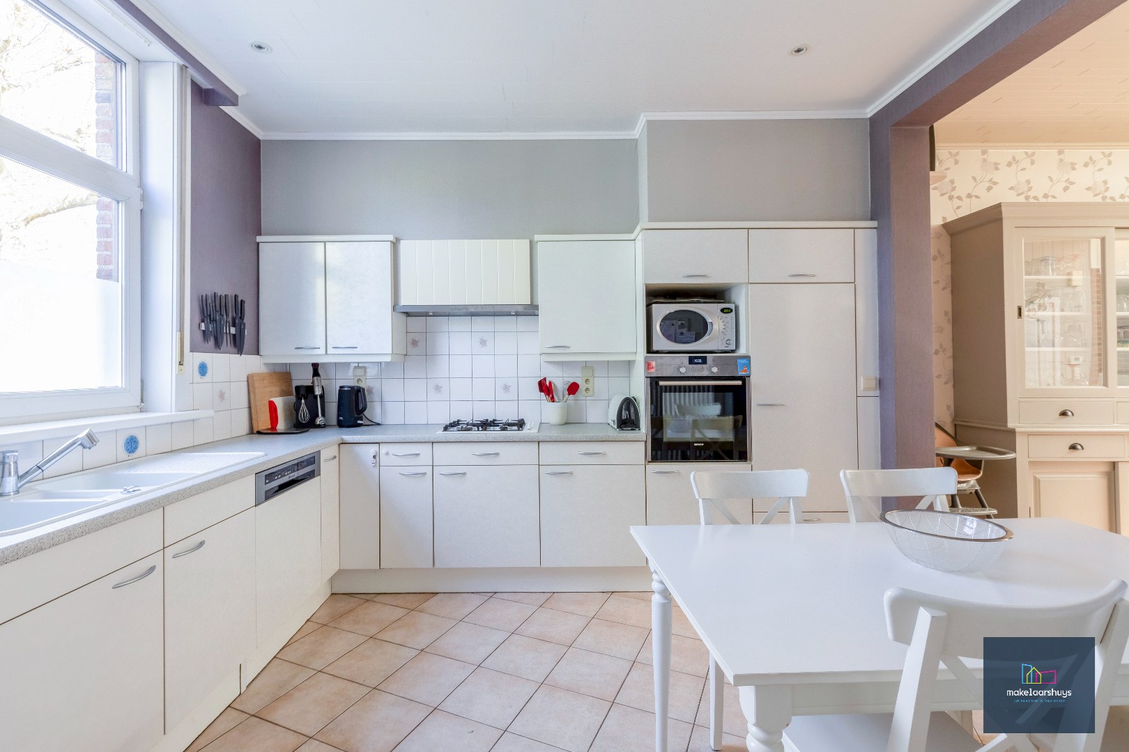 Goed onderhouden en ruime woning in rij met tuin/terras te Wondelgem 