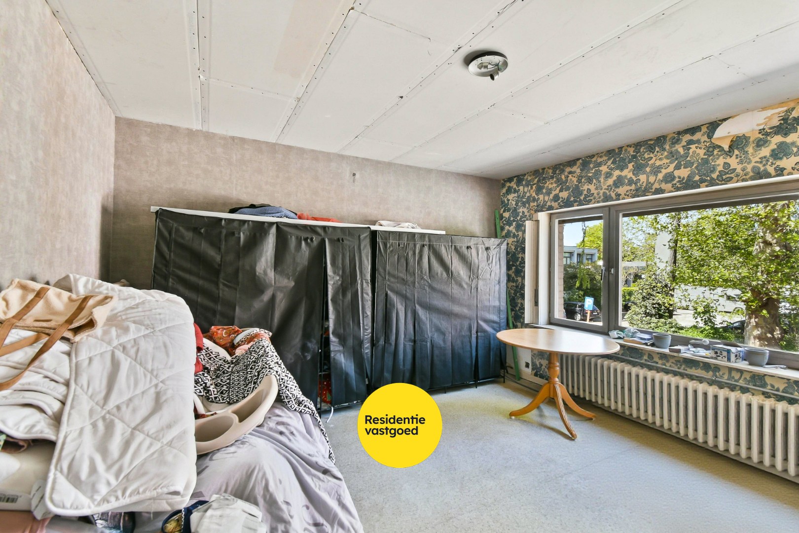 Woning met drie slaapkamers, garage en zonnige tuin 