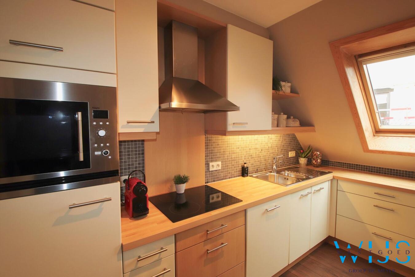 Charmant instapklaar tweeslaapkamer appartement in centrum Ertvelde! 