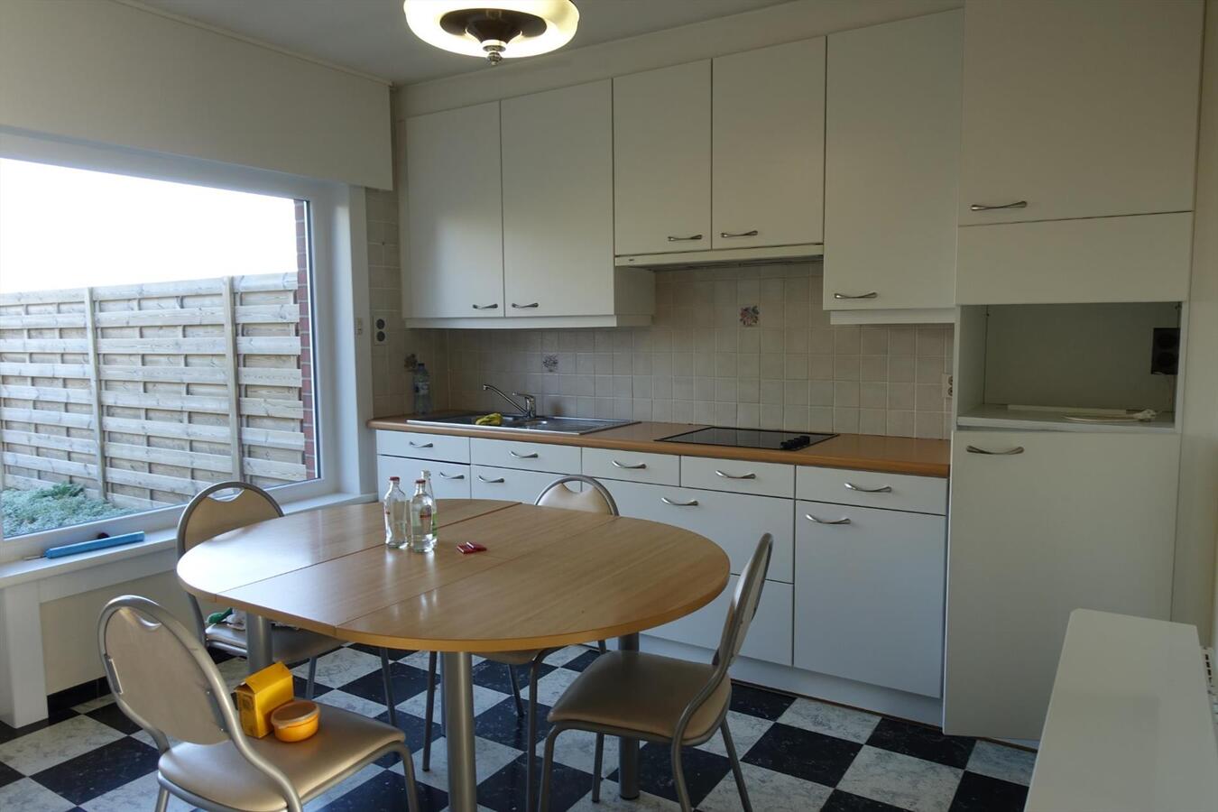 Degelijke rijwoning met garage en grote tuin 