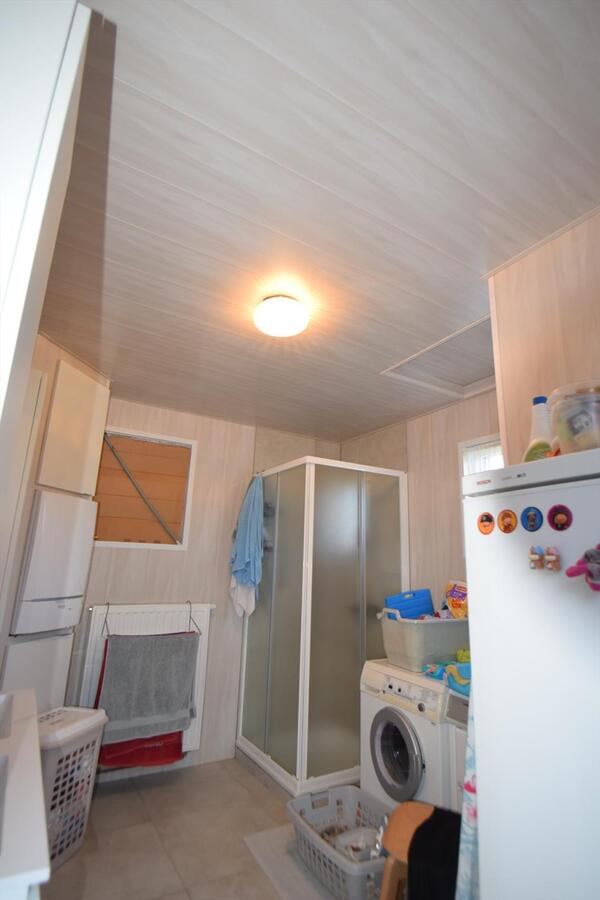 Ruime halfopen 3-slaapkamer-woning met garage en tuin 