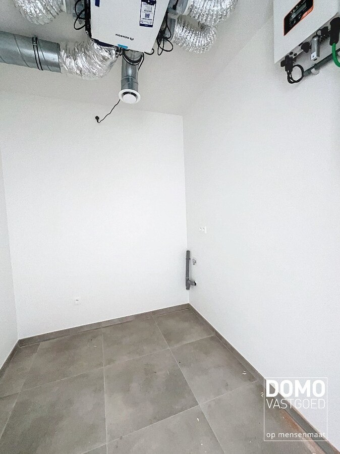 NIEUWBOUWAPPARTEMENT MET 2 SLAAPKAMERS, RUIM TERRAS, ONDERGRONDSE AUTOSTANDPLAATS EN KELDERBERGING IN MAASMECHELEN 