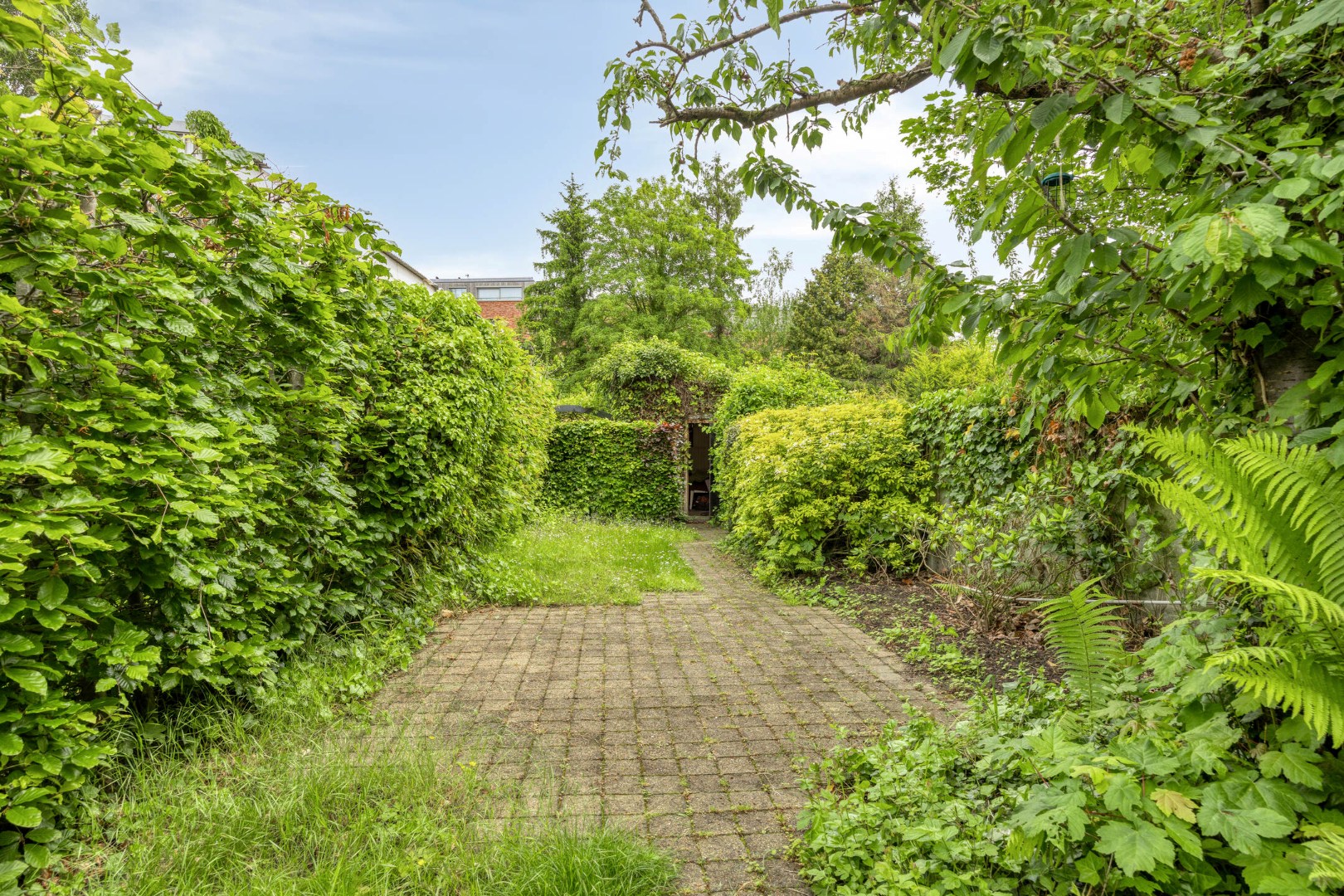 Ruime stadswoning / opbrengstpand  met achteruitgang via Janseniusstraat met 4 slaapkamers, garage en tuin te Leuven- EPC 239kwh/m2 