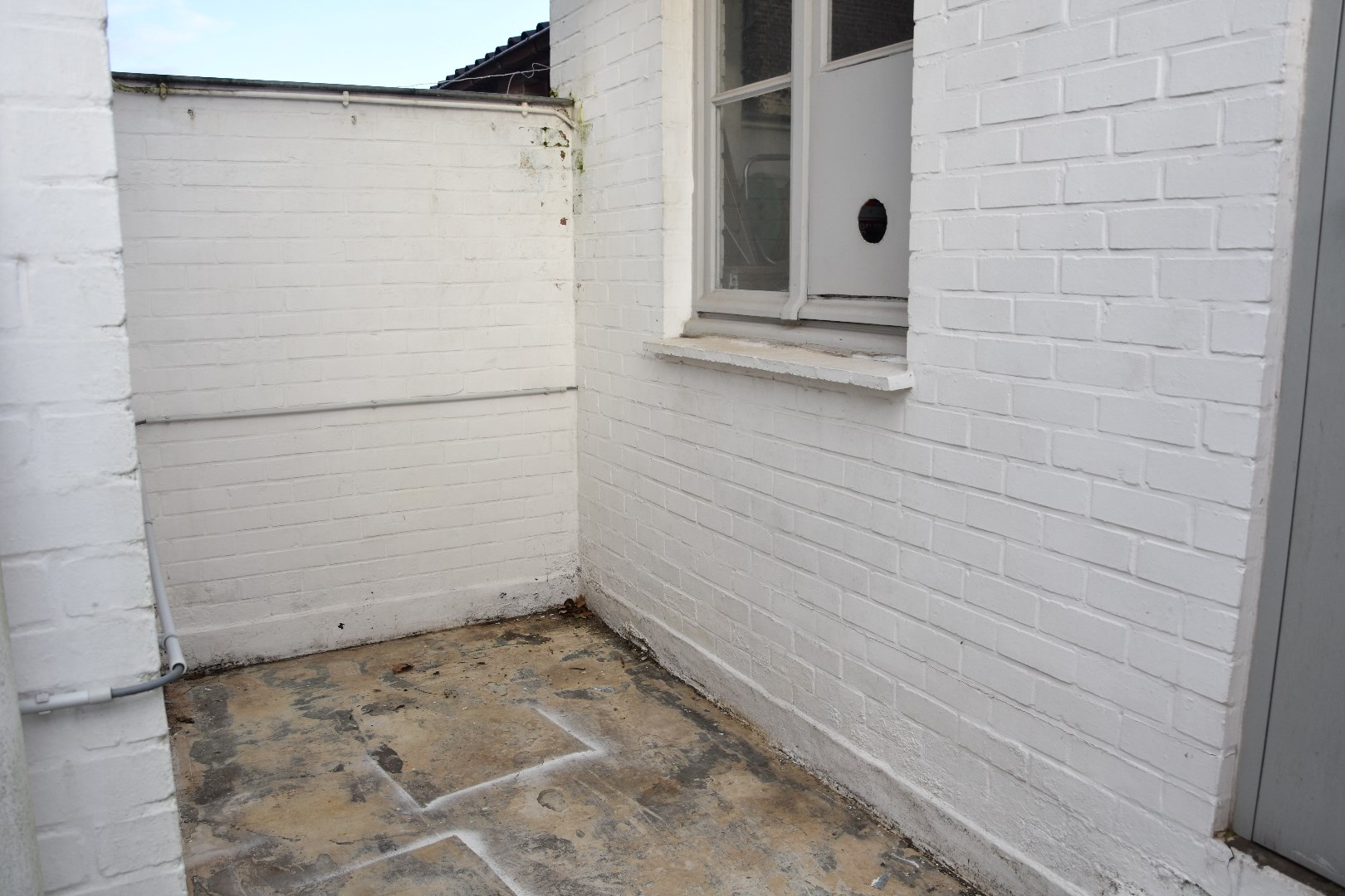 Opgefriste rijwoning met stadskoertje 