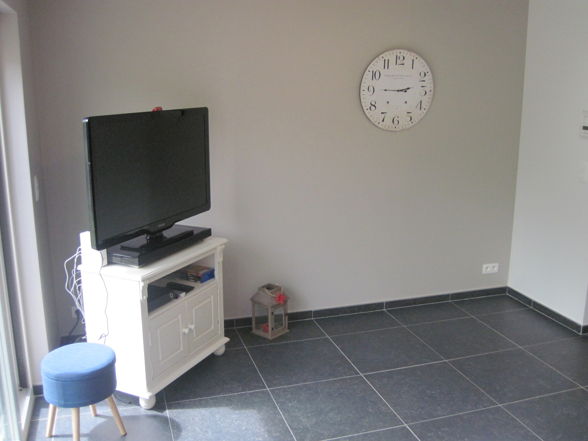 Recent vernieuwde rijwoning nabij de Schelde. 