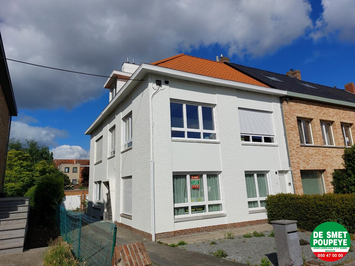 Gelijkvloersappartement met terras en garage 