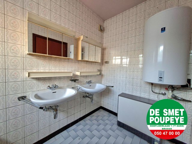 Ruime rijwoning met garage en tuin 