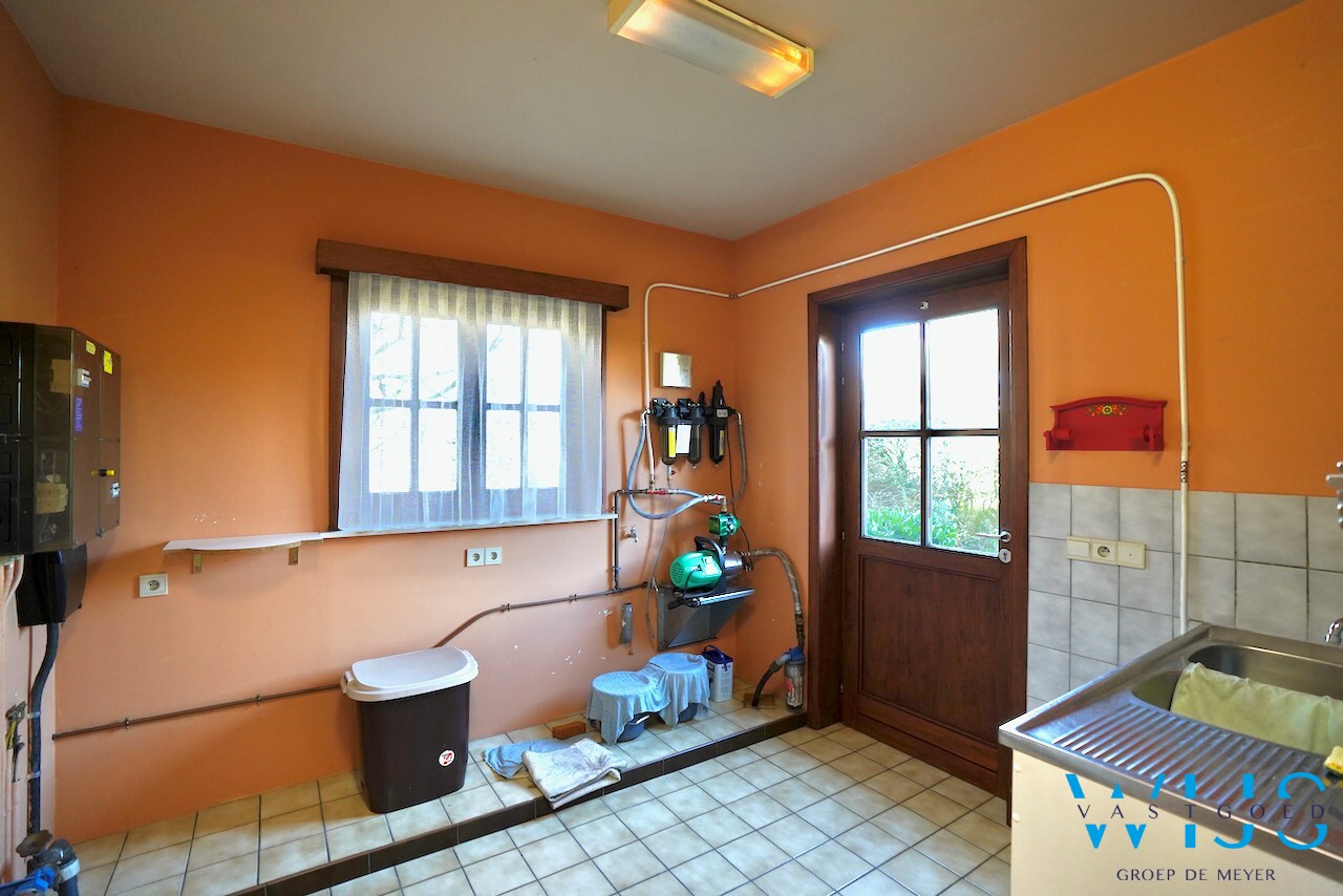 Fantastische open bebouwing met dubbele garage in gegeerde woonwijk te Evergem 