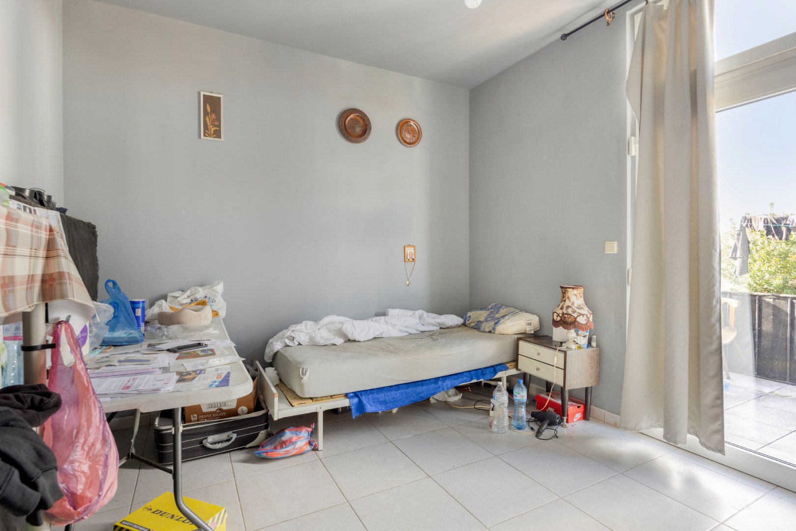 Op te frissen opbrengsteigendom met 3 appartementen en garage in Leopoldsburg 