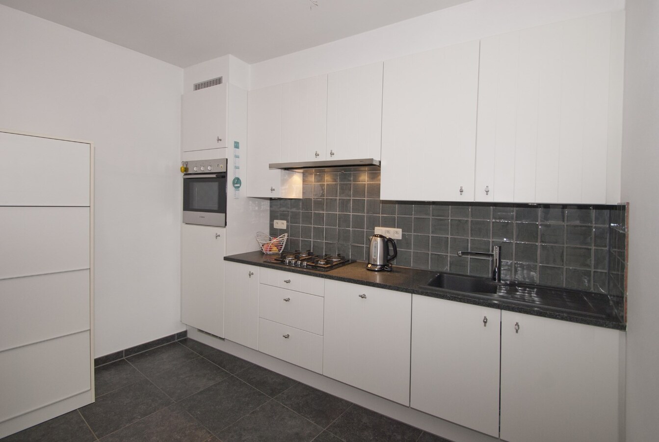 Instapklaar appartement met lift - 1 slpk, terras, 2 parkings 
