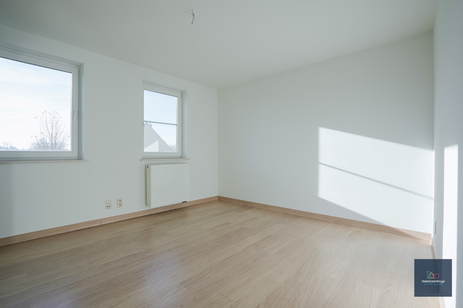 Ruime half-open bebouwing te Heusden met garage en tuin 