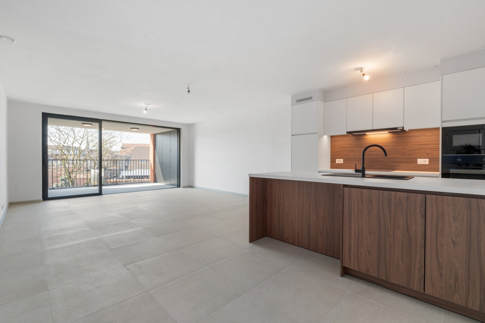 Nieuwbouwappartement met één slaapkamer, terras en ondergrondse autostaanplaats te koop in Zulte 