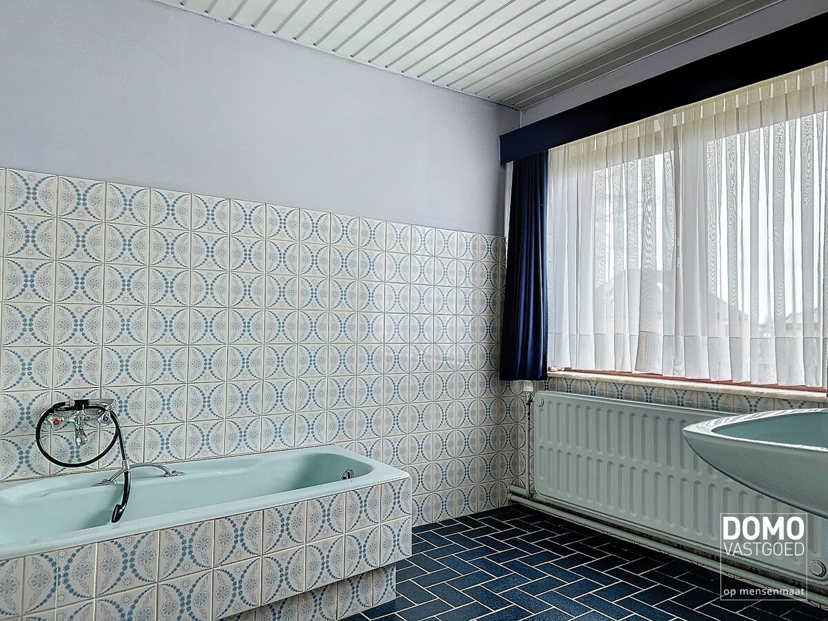 Charmante woning met ruime tuin en inpandige garage, rustig gelegen te Spalbeek. 