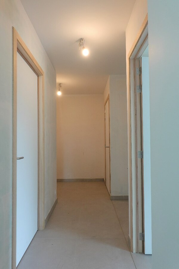 Nieuwbouwappartement met terras en tuin 