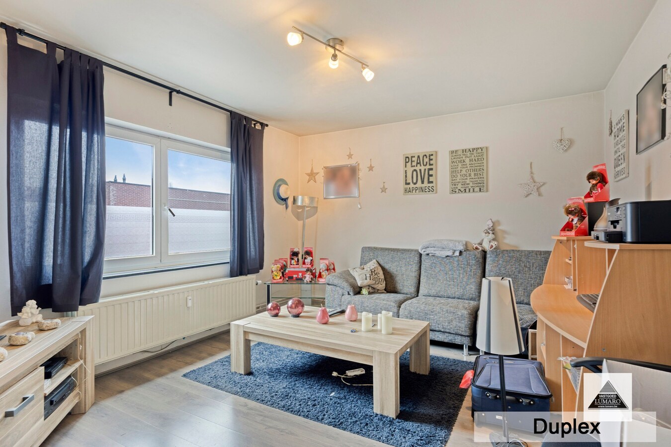 Dilsen-centrum - opbrengstpand: winkel + 2 appartementen 