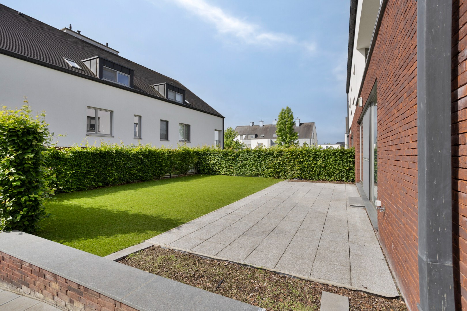 Instapklaar gelijkvloers appartement met groot terras, tuin en garagebox in Kumtich - EPC 104 KWH/m² 
