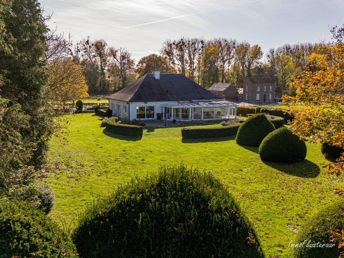 Rural villa with multifunctional outbuilding on approximately 51 acres in Bilzen 