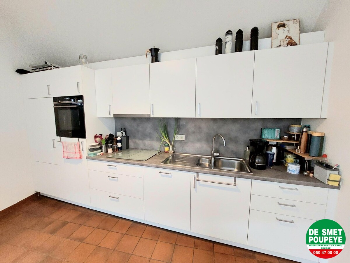 Rijwoning met gemeenschappelijk terras 