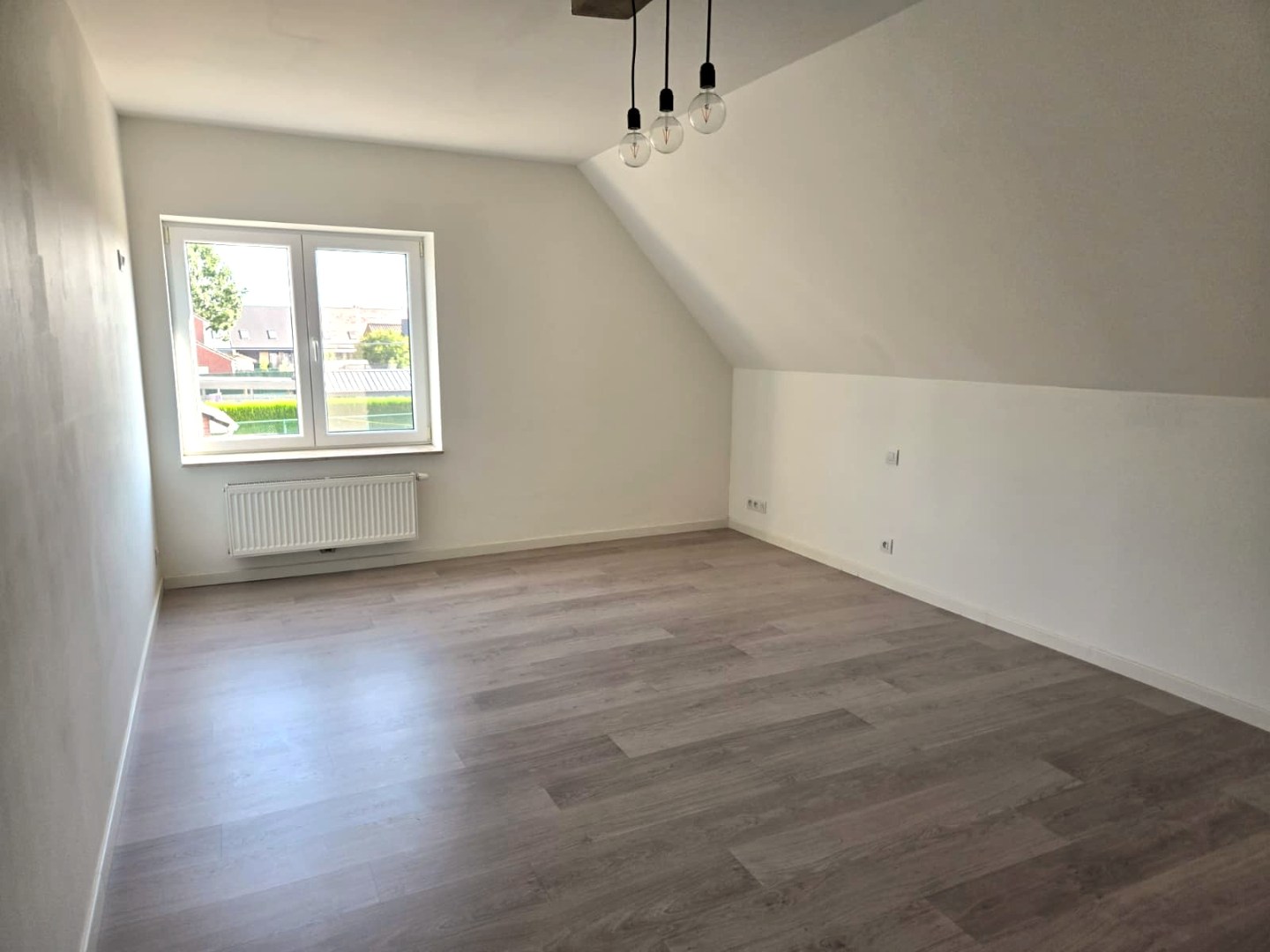 Energiezuinige halfopen woning met tuin en carport te Zulte 