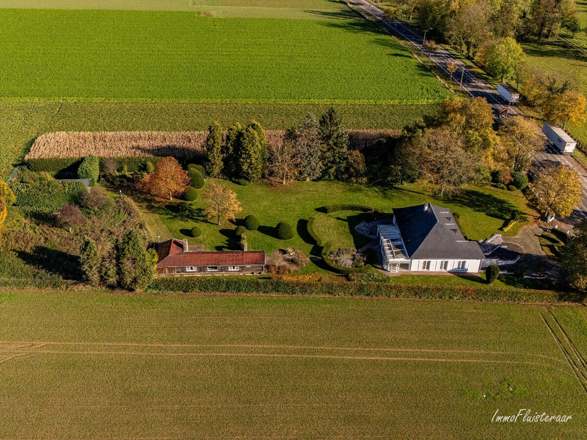 Rural villa with multifunctional outbuilding on approximately 51 acres in Bilzen 