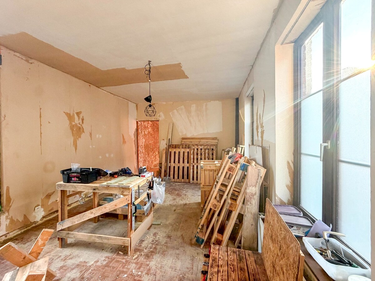 UNIEK en ruime KARAKTERVOLLE  woning met handelspand nabij de Grote Markt ! 