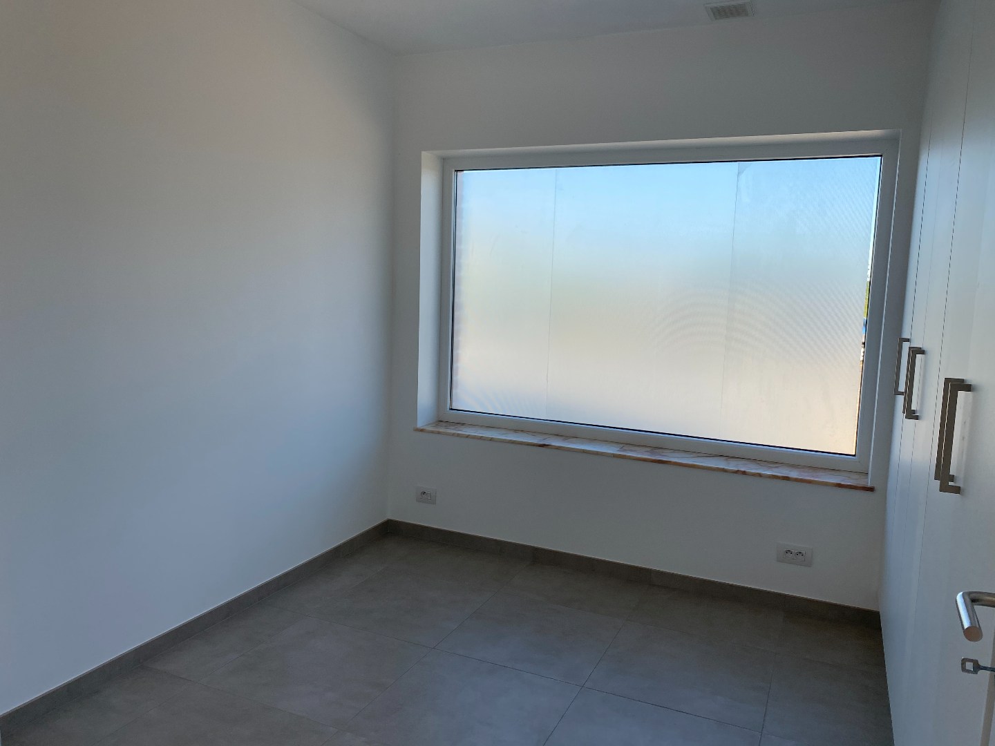 Energiezuinige halfopen woning met tuin en carport te Zulte 
