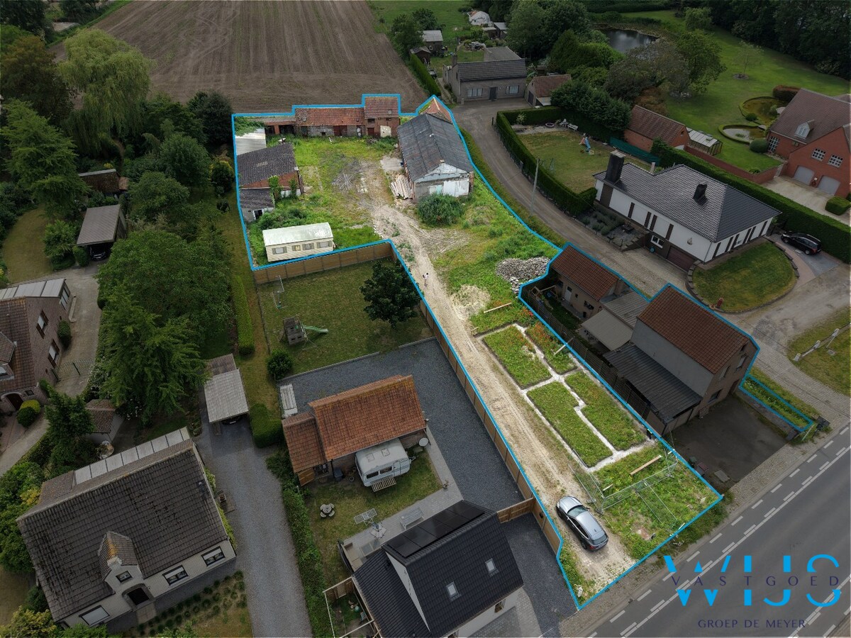 Perceel van 1.771 m² met woning op plan + bijgebouwen ! 