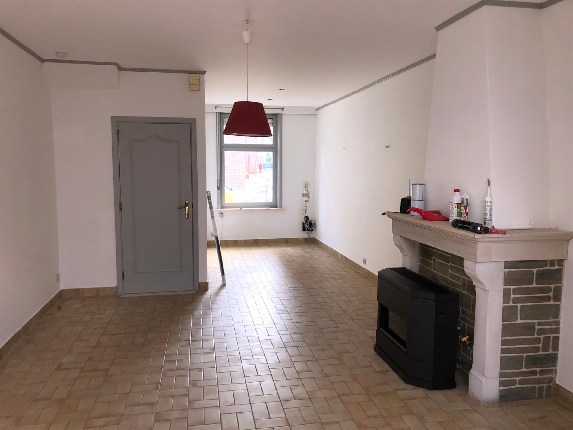 Opgefriste rijwoning met stadskoertje 