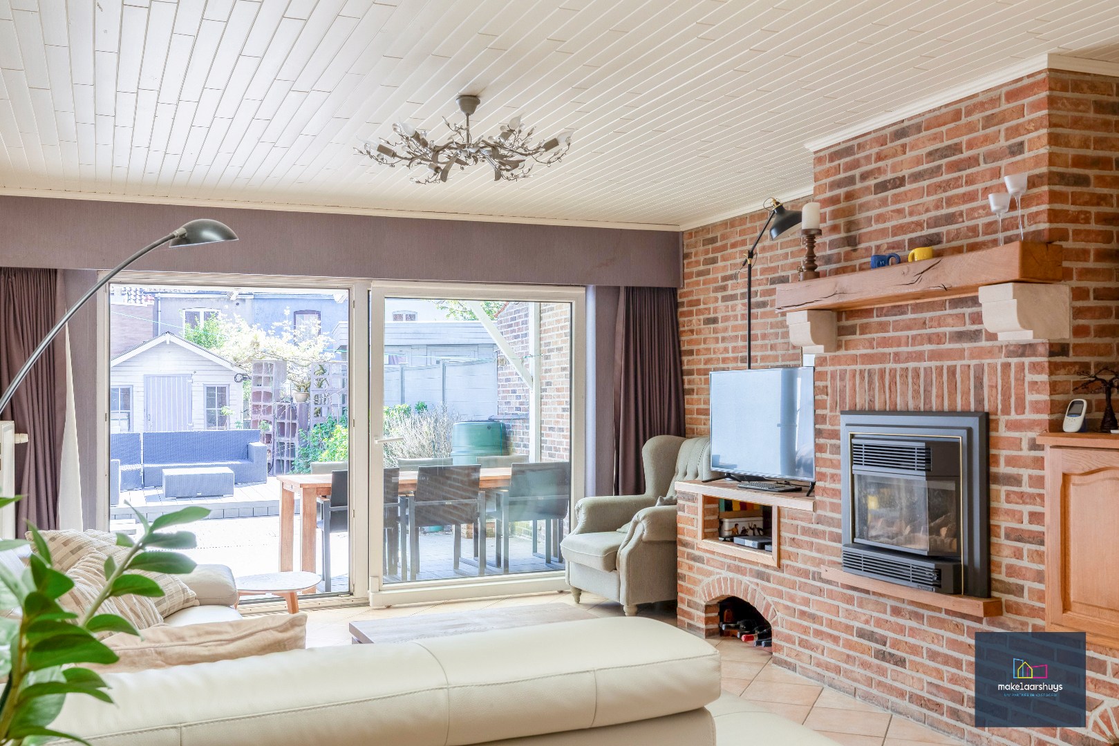 Goed onderhouden en ruime woning in rij met tuin/terras te Wondelgem 