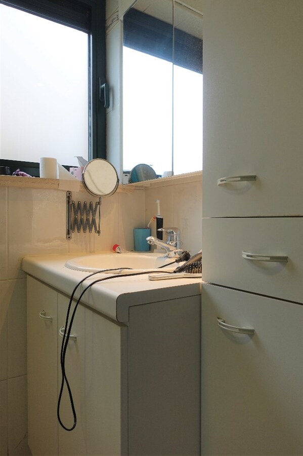 Gezellig gelijkvloersappartement met zonnige tuin en garage 