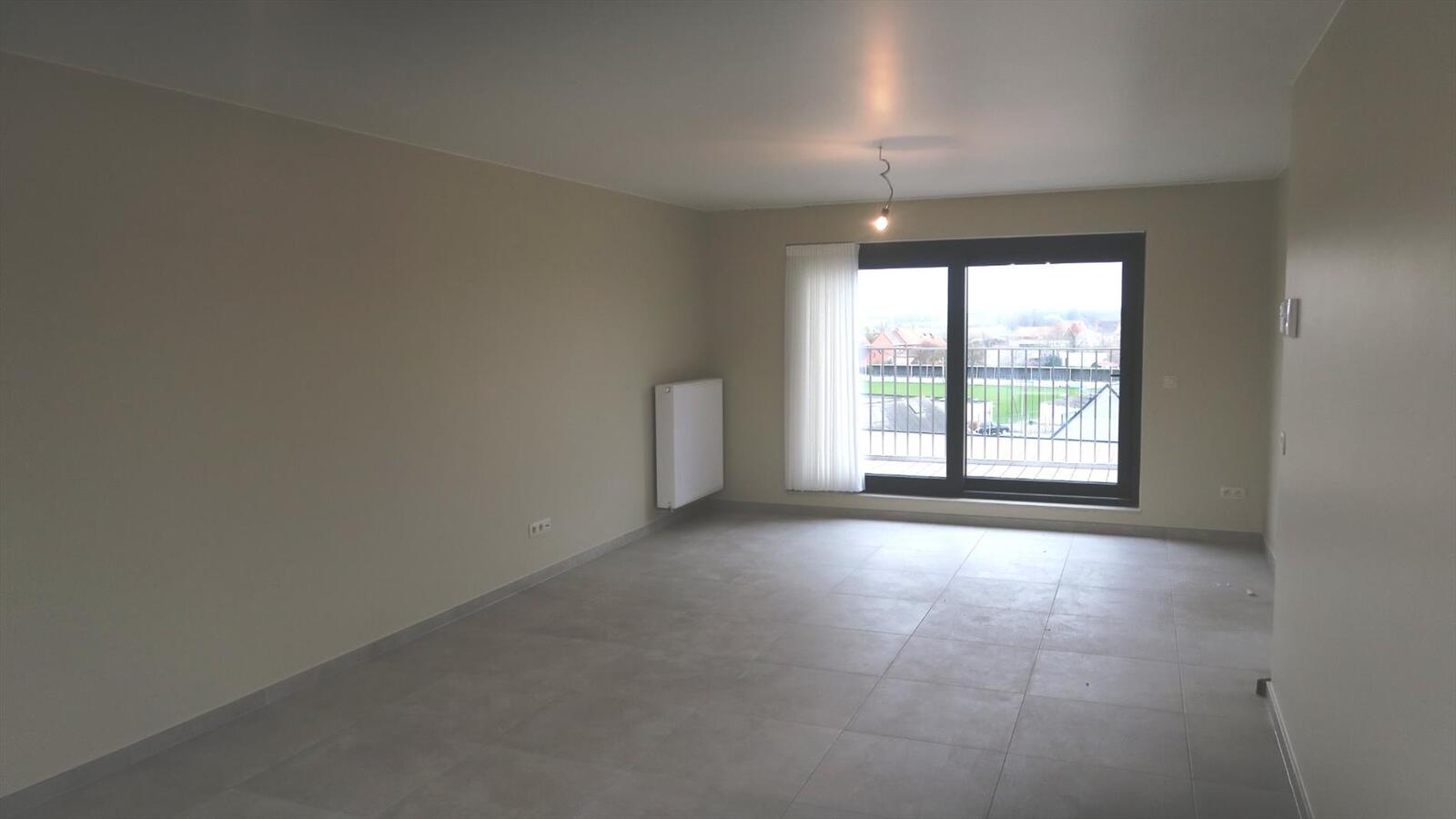 Ruim dakappartement met 2 slaapkamers op de Markt in Houthulst 