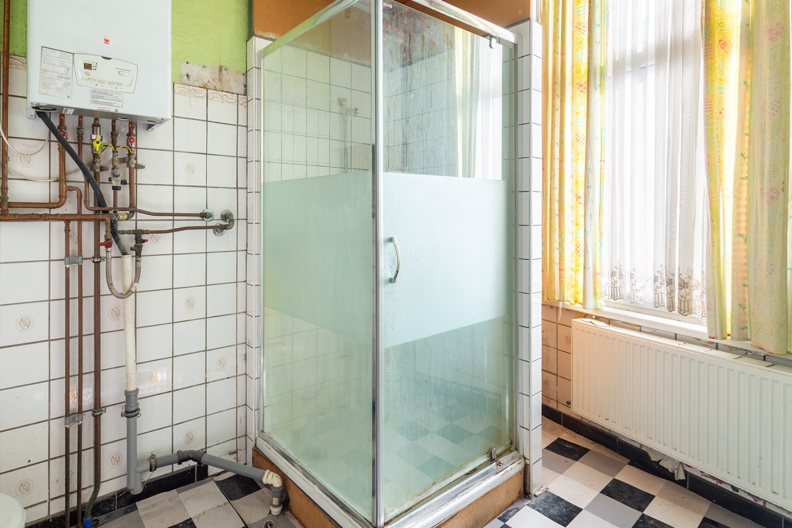 Unieke renovatiewoning met karakter en potentieel in hartje Ledeberg 